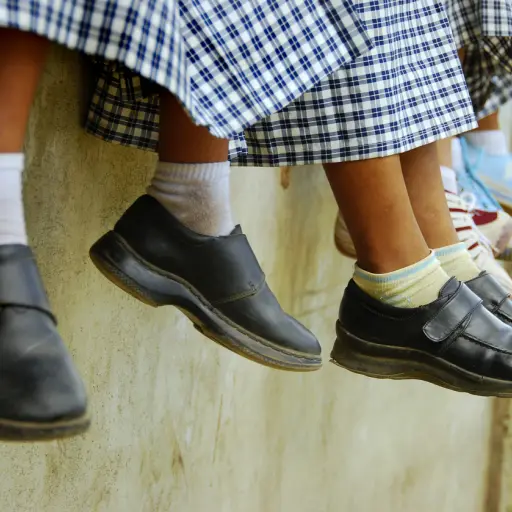 School children hanging out outside their roon