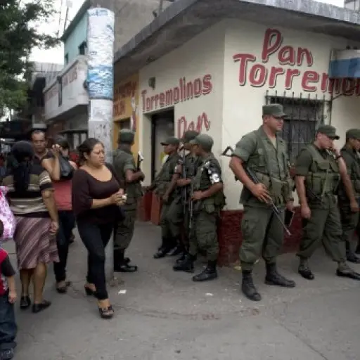 Soldiers patrol on May 11, 2012 along El Limon neighborhood, northern outskirts of Guatemala City, during an operation in the frame of the security plan of President Otto Perez Molina to reduce the incidence of violence in the country. AFP PHOTO Johan ORD