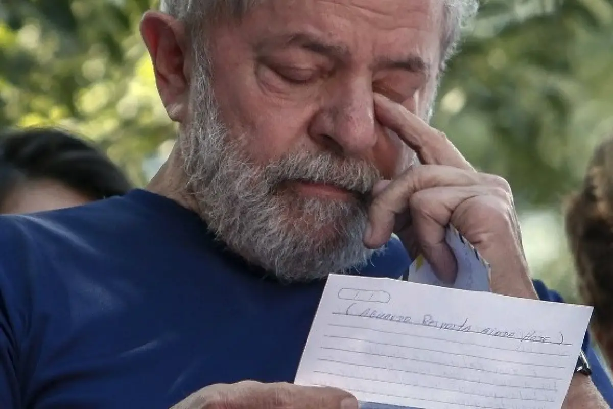 Brazilian ex-president (2003-2011) Luiz Inacio Lula da Silva gestures as he reads after attending a Catholic Mass in memory of his late wife Marisa Leticia, at the metalworkers' union building in Sao Bernardo do Campo, in metropolitan Sao Paulo, Brazil, o