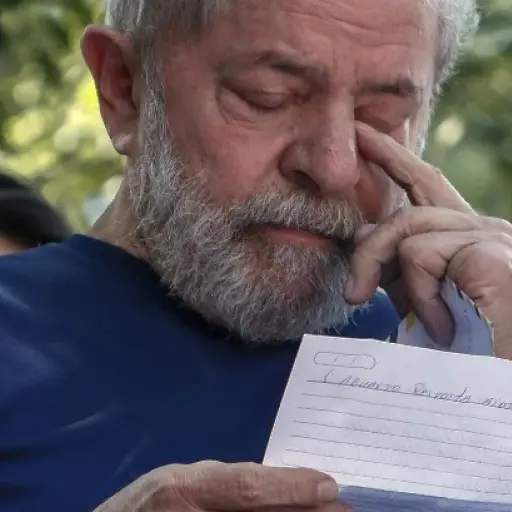 Brazilian ex-president (2003-2011) Luiz Inacio Lula da Silva gestures as he reads after attending a Catholic Mass in memory of his late wife Marisa Leticia, at the metalworkers' union building in Sao Bernardo do Campo, in metropolitan Sao Paulo, Brazil, o