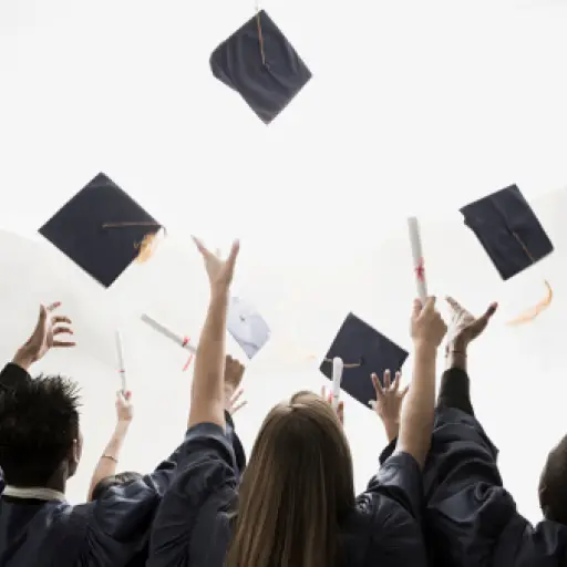 Graduates throwing mortarboards