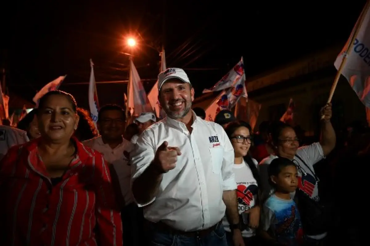 Guatemalan candidate for the coalition PAN-Podemos party Roberto Arzu walks with supporters during a political rally in La Democracia municipaity Escuintla departament, 90km south of Guatemala City, on June 12, 2019,ahead of the upcoming general election 