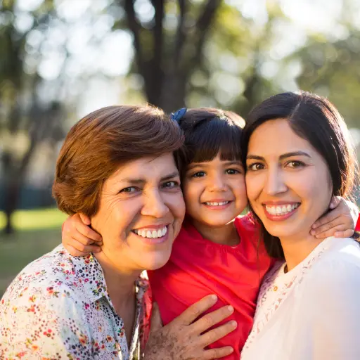 Latin family smiling at the camera in nature