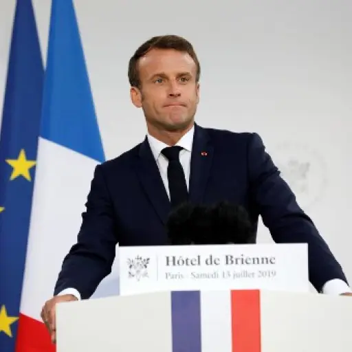 French President Emmanuel Macron delivers a speech at the residence of French Defense Ministry on the eve of Bastille Day, on July 13, 2019, in Paris. (Photo by Kamil Zihnioglu / POOL / AFP)