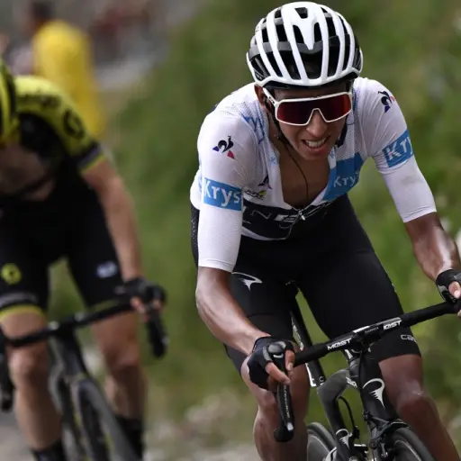 Colombia's Egan Bernal (R), wearing the best young's white jersey launches an attack followed by Great Britain's Simon Yates in a breakaway during the nineteenth stage of the 106th edition of the Tour de France cycling race between Saint-Jean-de-Maurienne