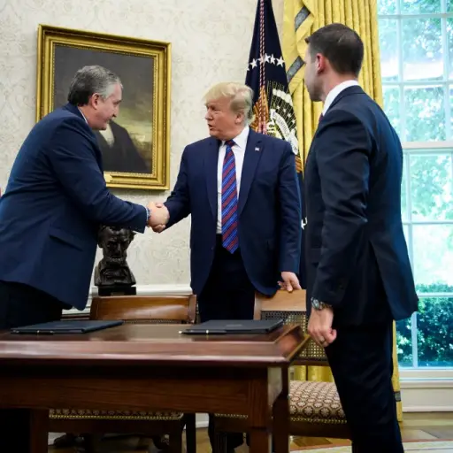 US President Donald Trump (C) shakes Guatemala's Interior Minister Enrique Degenhart (L) hand as acting US Secretary of Homeland Security Kevin K. McAleenan (R) watches after a safe-third agreement was signed, regarding people seeking asylum while passing