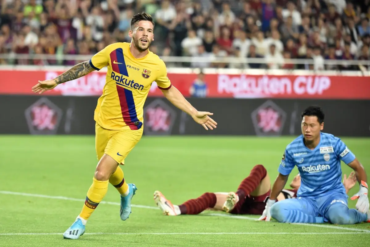 FC Barcelona's forward Carles Perez (L) celebrates his goal during the Rakuten Cup football match between Vissel Kobe and FC Barcelona, in Kobe on July 27, 2019. (Photo by Kazuhiro NOGI / AFP)