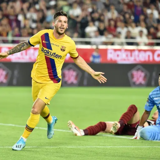 FC Barcelona's forward Carles Perez (L) celebrates his goal during the Rakuten Cup football match between Vissel Kobe and FC Barcelona, in Kobe on July 27, 2019. (Photo by Kazuhiro NOGI / AFP)