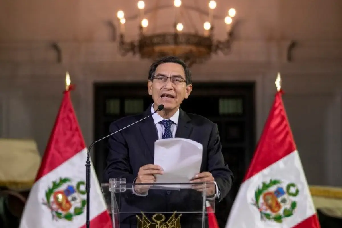 Handout picture released by national news service Andina showing Peruvian President Martin Vizcarra announcing the dissolution of the Congress on a televised message to the nation, in Lima, on September 30, 2019. - Vizcarra constitutionally dissolved the 