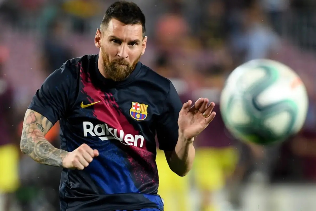 Barcelona's Argentine forward Lionel Messi eyes the ball as he warms up prior to the Spanish league football match between FC Barcelona and Villarreal CF at the Camp Nou stadium in Barcelona, on September 24, 2019. (Photo by LLUIS GENE / AFP)