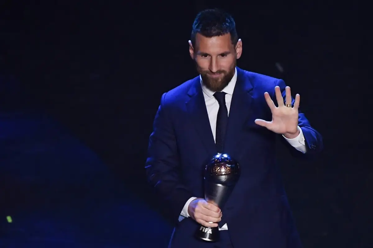 Argentina and Barcelona forward Lionel Messi reacts after winning the trophy for the Best FIFA Men's Player of 2019 Award, during The Best FIFA Football Awards ceremony, on September 23, 2019 in Milan. (Photo by Marco Bertorello / AFP)