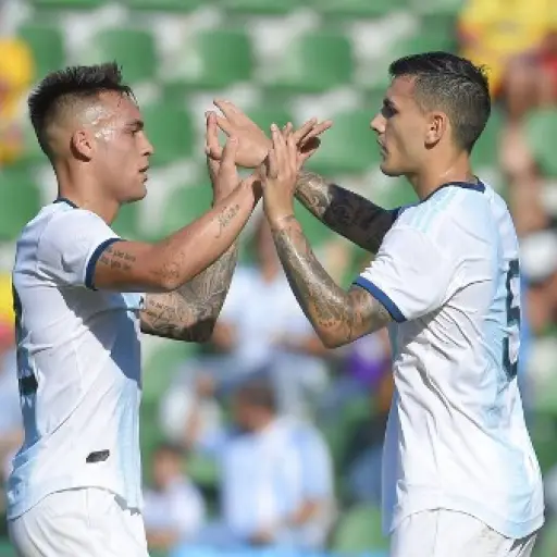 Argentina's  midfielder Leandro Paredes (R) celebrates with Argentina's forward Lautaro Martinez after scoring during the International Friendly football match against Ecuador at the Martinez Valero stadium in Elche, on October 13, 2019. (Photo by JOSE JO