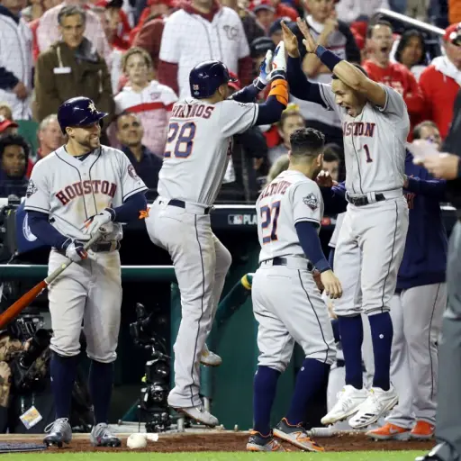 WASHINGTON, DC - OCTOBER 25: Robinson Chirinos #28 of the Houston Astros is congratulated by his teammate Carlos Correa #1 after hitting a solo home run against the Washington Nationals during the sixth inning in Game Three of the 2019 World Series at Nat