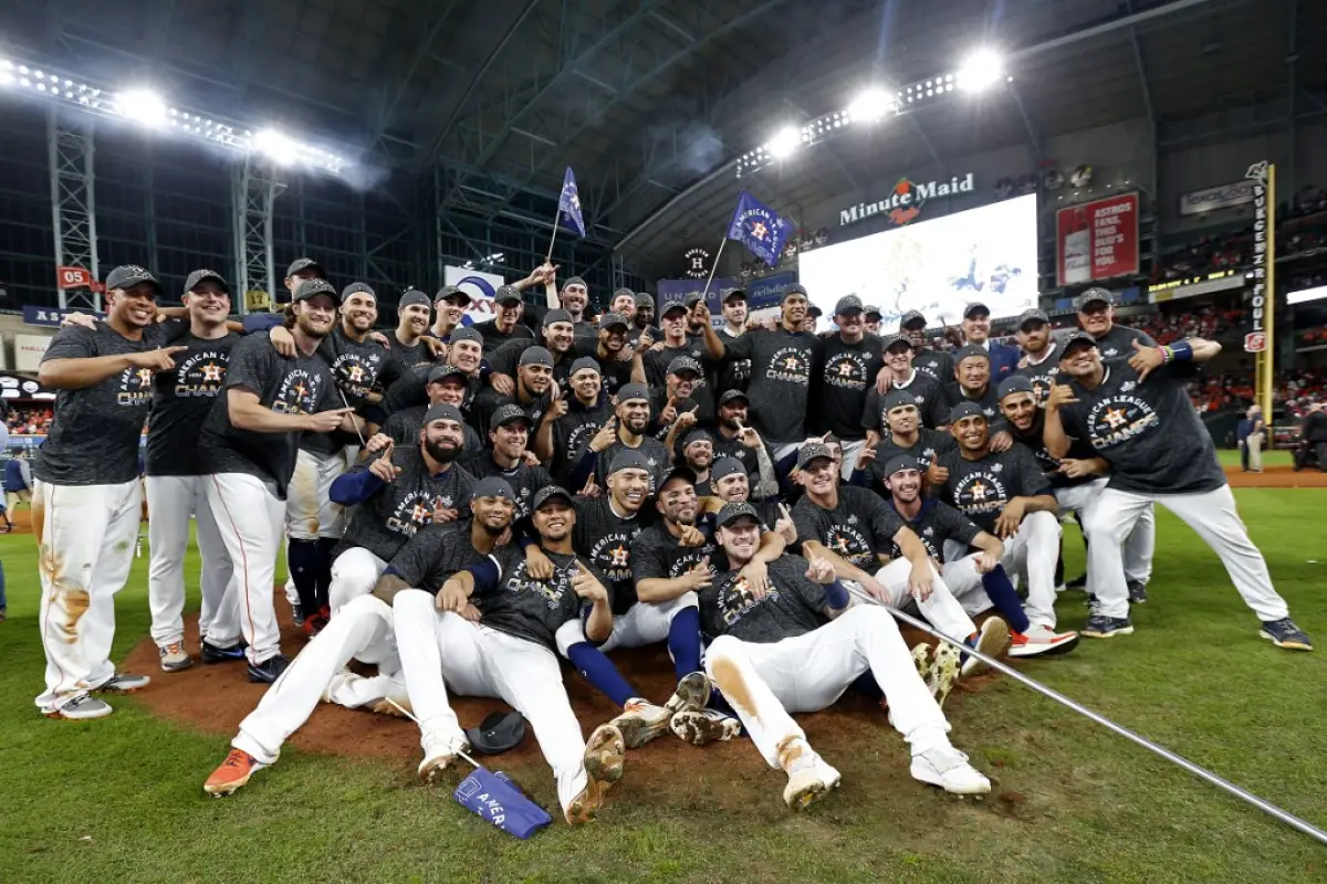 HOUSTON, TEXAS - OCTOBER 19: The Houston Astros pose for a photo as they celebrate their 6-4 win against the New York Yankees in game six of the American League Championship Series at Minute Maid Park on October 19, 2019 in Houston, Texas.   Elsa/Getty Im