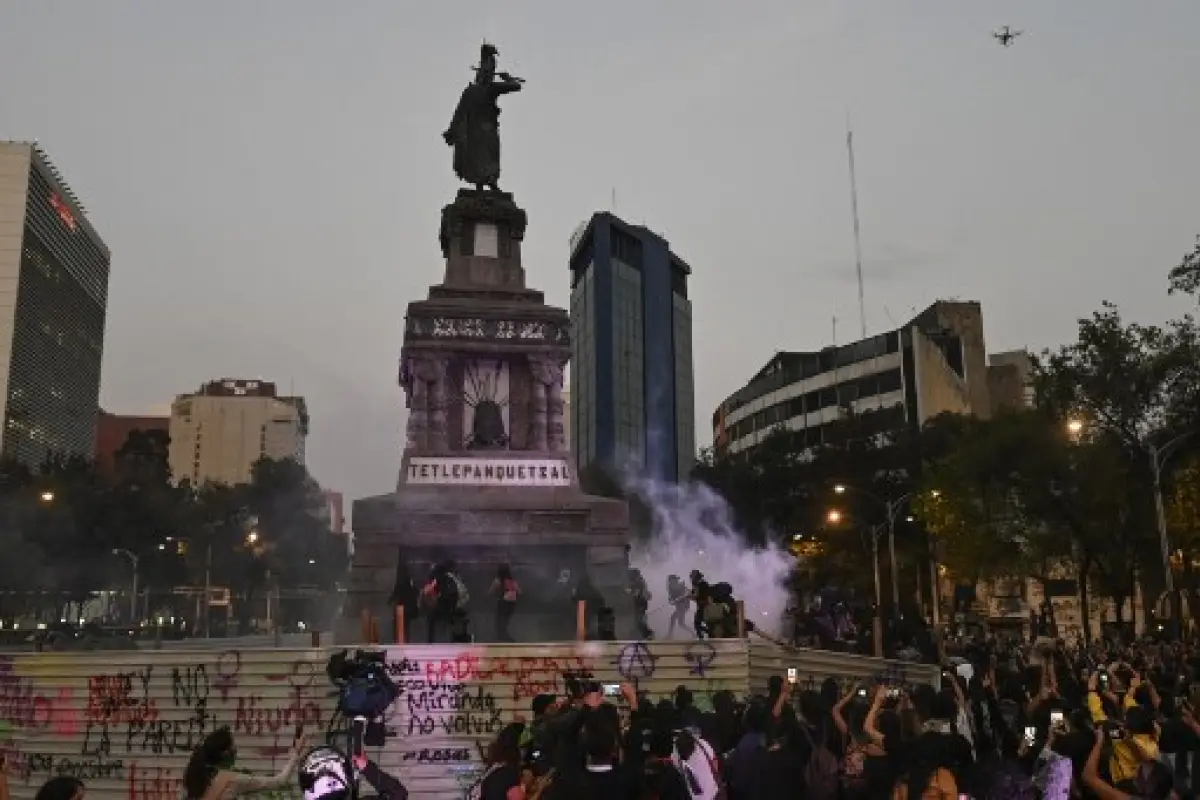 Activists protest on the commemoration of the International Day for the Elimination of Violence Against Women, in Mexico City, on November 25, 2019. (Photo by PEDRO PARDO / AFP)