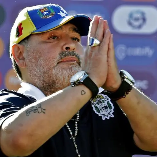 (FILES) In this file photo taken on November 02, 2019, Gimnasia y Esgrima team coach Diego Armando Maradona gestures to supporters as he leaves the field after an Argentina First Division Superliga football match against Estudiantes, at El Bosque stadium,