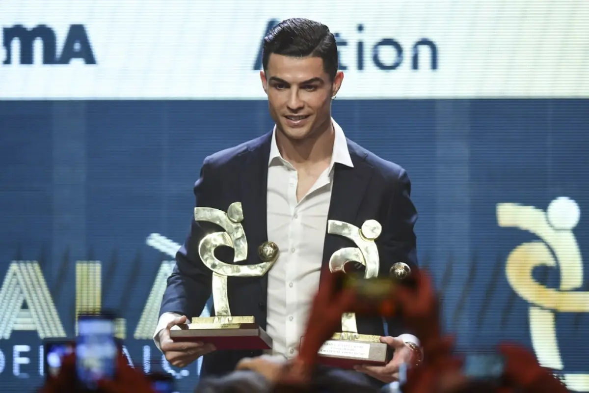 Juventus' Portuguese forward Cristiano Ronaldo receives the award of best player of the year of the Italian championship Serie A during the 'Gran Gala del Calcio' awards ceremony, organised by the Italian Footballers' Association (AIC), on December 2, 201