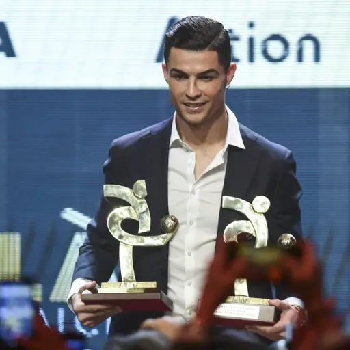 Juventus' Portuguese forward Cristiano Ronaldo receives the award of best player of the year of the Italian championship Serie A during the 'Gran Gala del Calcio' awards ceremony, organised by the Italian Footballers' Association (AIC), on December 2, 201