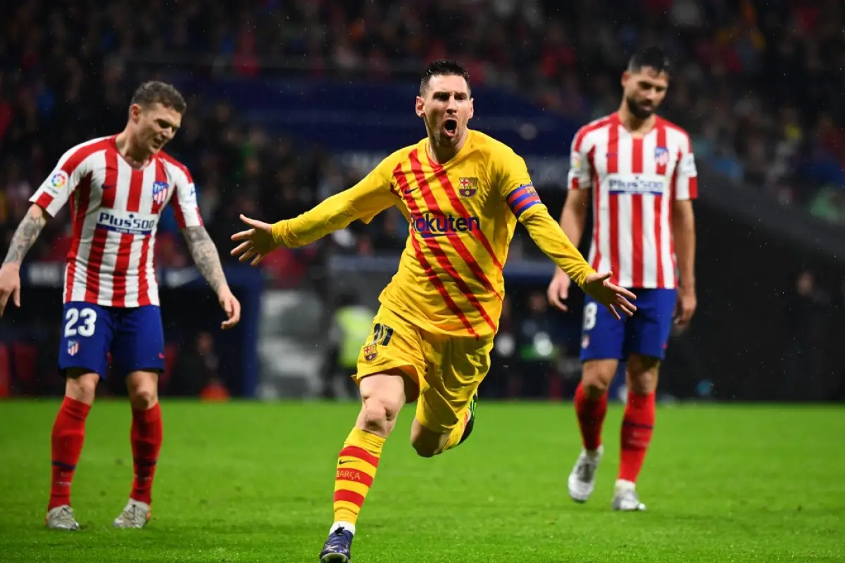 Barcelona's Argentine forward Lionel Messi celebrates after scoring  during the Spanish league football match between Club Atletico de Madrid and FC Barcelona at the Wanda Metropolitano stadium in Madrid, on December 1, 2019. (Photo by GABRIEL BOUYS / AFP