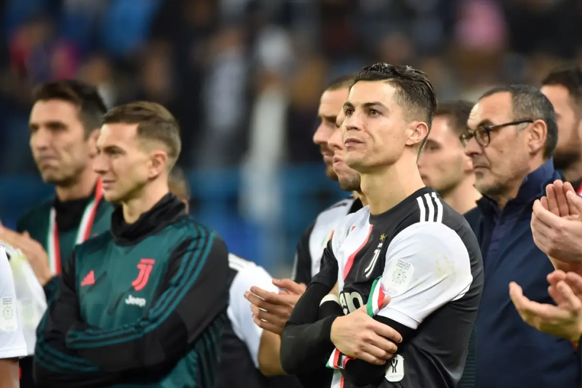 Juventus' Portuguese forward Cristiano Ronaldo (C) reacts following their defeat the Supercoppa Italiana final football match between Juventus and Lazio at the King Saud University Stadium in the Saudi capital Riyadh on December 22, 2019. (Photo by FAYEZ 