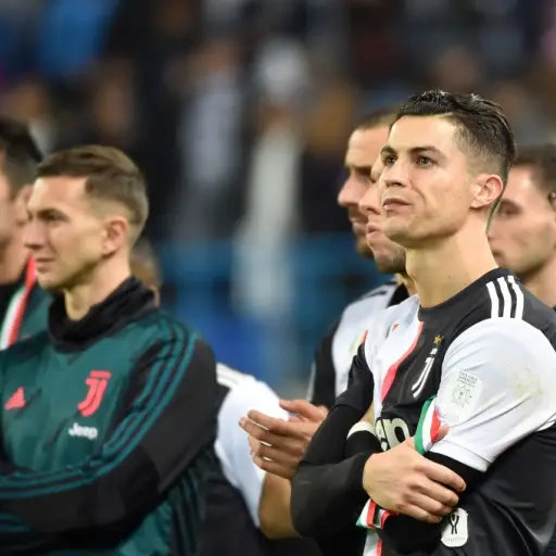 Juventus' Portuguese forward Cristiano Ronaldo (C) reacts following their defeat the Supercoppa Italiana final football match between Juventus and Lazio at the King Saud University Stadium in the Saudi capital Riyadh on December 22, 2019. (Photo by FAYEZ 