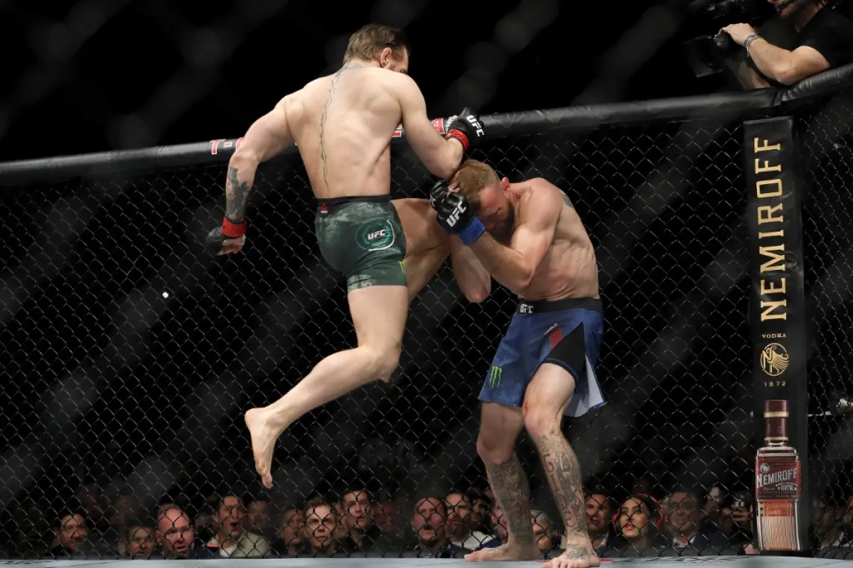 LAS VEGAS, NEVADA - JANUARY 18: Conor McGregor lands a knee to the face of Donald Cerrone in the first round in a welterweight bout during UFC246 at T-Mobile Arena on January 18, 2020 in Las Vegas, Nevada.   Steve Marcus/Getty Images/AFP