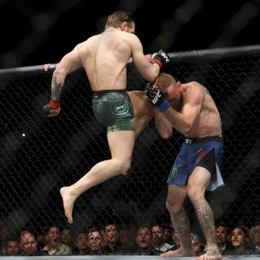 LAS VEGAS, NEVADA - JANUARY 18: Conor McGregor lands a knee to the face of Donald Cerrone in the first round in a welterweight bout during UFC246 at T-Mobile Arena on January 18, 2020 in Las Vegas, Nevada.   Steve Marcus/Getty Images/AFP