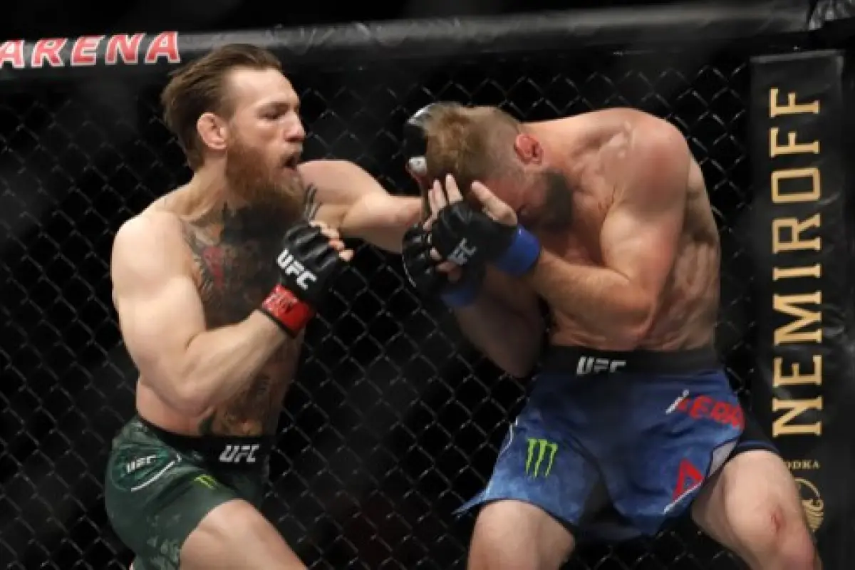 LAS VEGAS, NEVADA - JANUARY 18: Conor McGregor (L) punches Donald Cerrone in a welterweight bout during UFC246 at T-Mobile Arena on January 18, 2020 in Las Vegas, Nevada. McGregor won by first-round TKO.   Steve Marcus/Getty Images/AFP