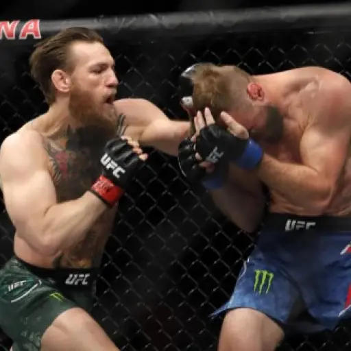 LAS VEGAS, NEVADA - JANUARY 18: Conor McGregor (L) punches Donald Cerrone in a welterweight bout during UFC246 at T-Mobile Arena on January 18, 2020 in Las Vegas, Nevada. McGregor won by first-round TKO.   Steve Marcus/Getty Images/AFP
