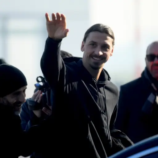 Newly appointed AC Milan forward Zlatan Ibrahimovic waves upon his arrival at  Linate airport, on January 2, 2020. - Ibrahimovic has signed with AC Milan on a six-month deal, promising to help rescue the struggling Serie A outfit's season. The 38-year-old
