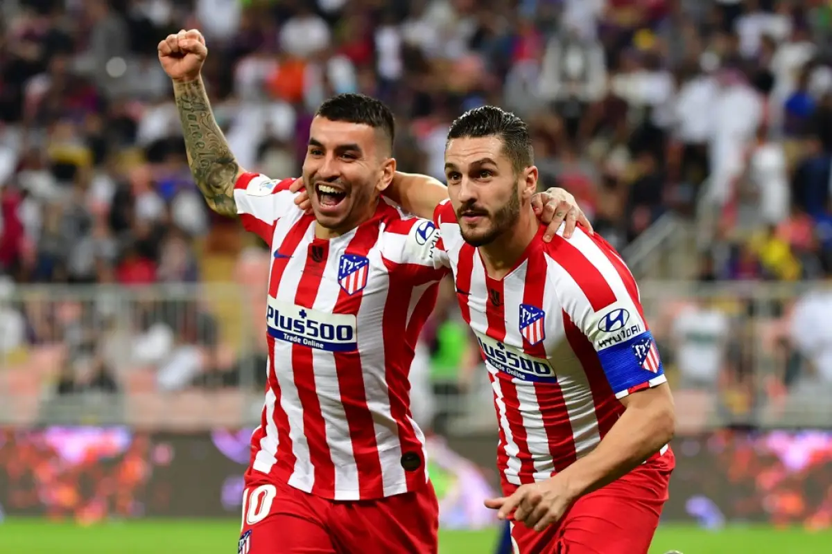 Atletico Madrid's Spanish midfielder Koke (R) celebrates his goal with Atletico Madrid's Argentine forward Angel Correa during the Spanish Super Cup semi final between Barcelona and Atletico Madrid on January 9, 2020, at the King Abdullah Sport City in th