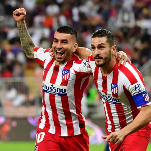Atletico Madrid's Spanish midfielder Koke (R) celebrates his goal with Atletico Madrid's Argentine forward Angel Correa during the Spanish Super Cup semi final between Barcelona and Atletico Madrid on January 9, 2020, at the King Abdullah Sport City in th