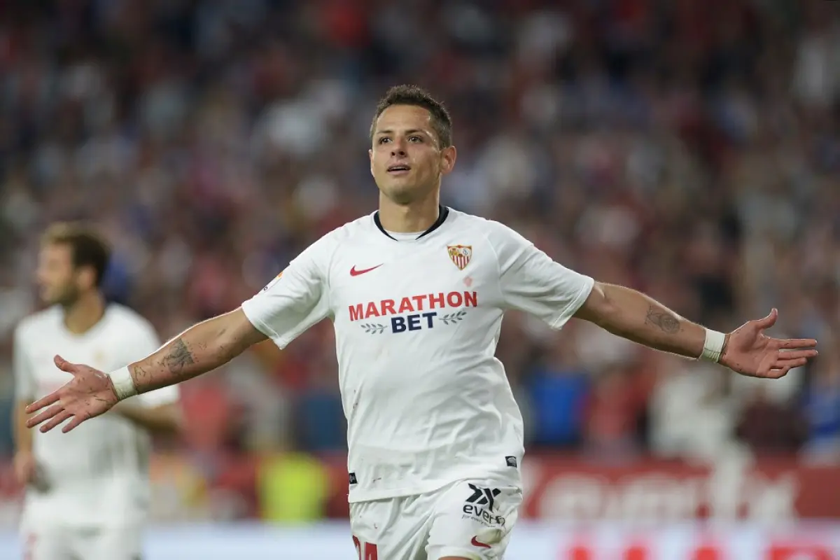 (FILES) In this file photo taken on October 27, 2019 Sevilla's Mexican forward Chicharito celebrates after scoring a goal during the Spanish league football match between Sevilla FC and Getafe CF at the Ramon Sanchez Pizjuan stadium in Seville. - The Los 