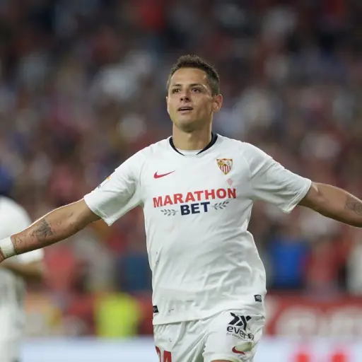 (FILES) In this file photo taken on October 27, 2019 Sevilla's Mexican forward Chicharito celebrates after scoring a goal during the Spanish league football match between Sevilla FC and Getafe CF at the Ramon Sanchez Pizjuan stadium in Seville. - The Los 