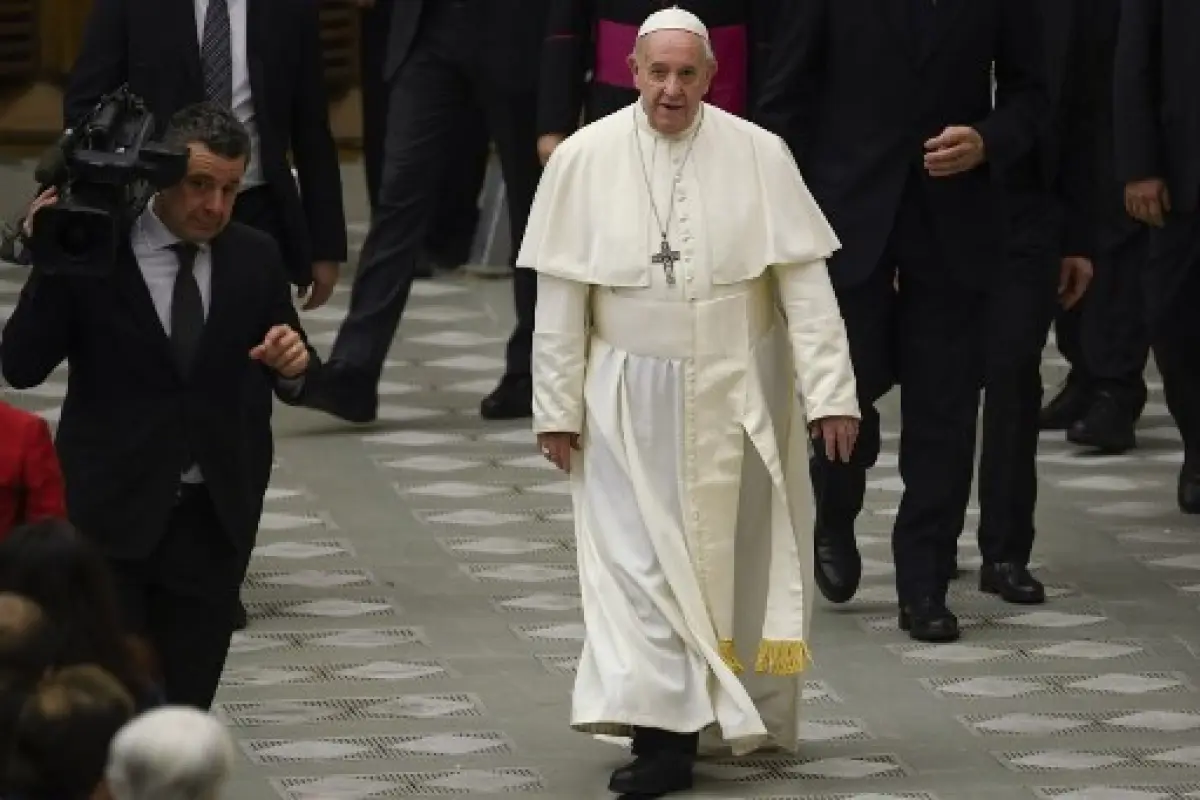 Pope Francis goes to meet with attendees during the weekly general audience on February 12, 2020 at Paul-VI hall in the Vatican. (Photo by Filippo MONTEFORTE / AFP)