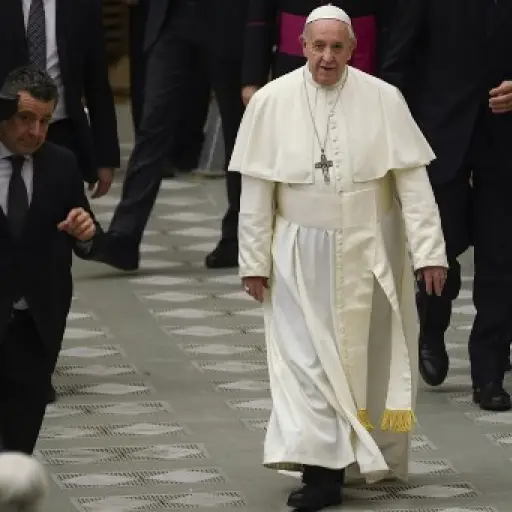 Pope Francis goes to meet with attendees during the weekly general audience on February 12, 2020 at Paul-VI hall in the Vatican. (Photo by Filippo MONTEFORTE / AFP)