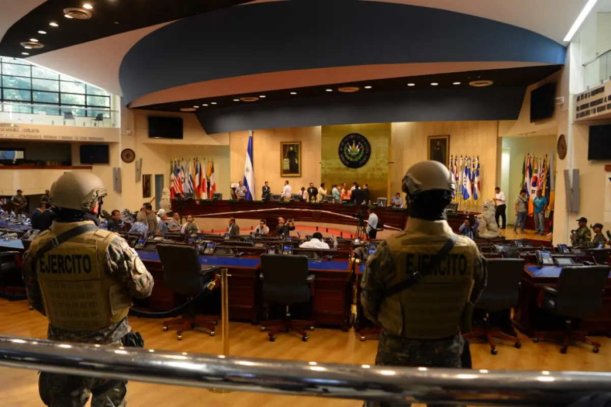 Members of the Salvadoran Armed Forces are seen within the Legislative Assembly during a protest outside the Legislative Assembly to make pressure on deputies to approve a loan to invest in security, in San Salvador on February 9, 2020. (Photo by STR / AF