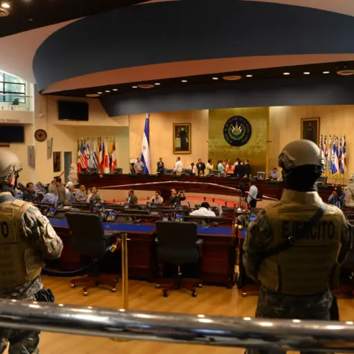 Members of the Salvadoran Armed Forces are seen within the Legislative Assembly during a protest outside the Legislative Assembly to make pressure on deputies to approve a loan to invest in security, in San Salvador on February 9, 2020. (Photo by STR / AF