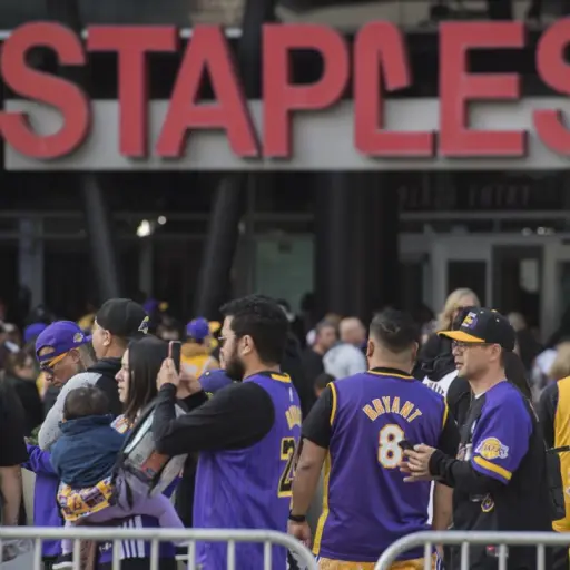 Fans arrive to attend the 