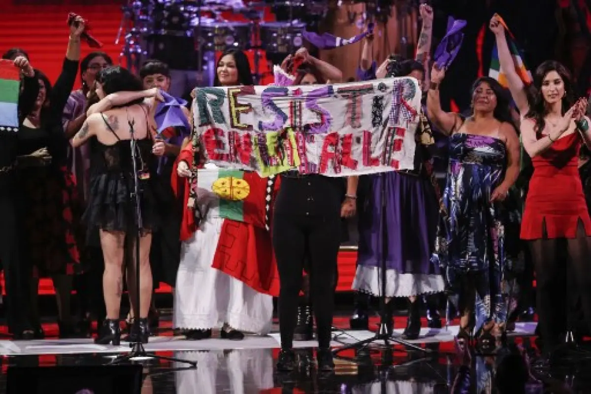 Singers with Chilean artist Mon Laferte show a banner reading "Resist on the Street" during the 61th Vina del Mar International Song Festival in Vina del Mar, Chile, on February 24, 2020. (Photo by JAVIER TORRES / AFP)