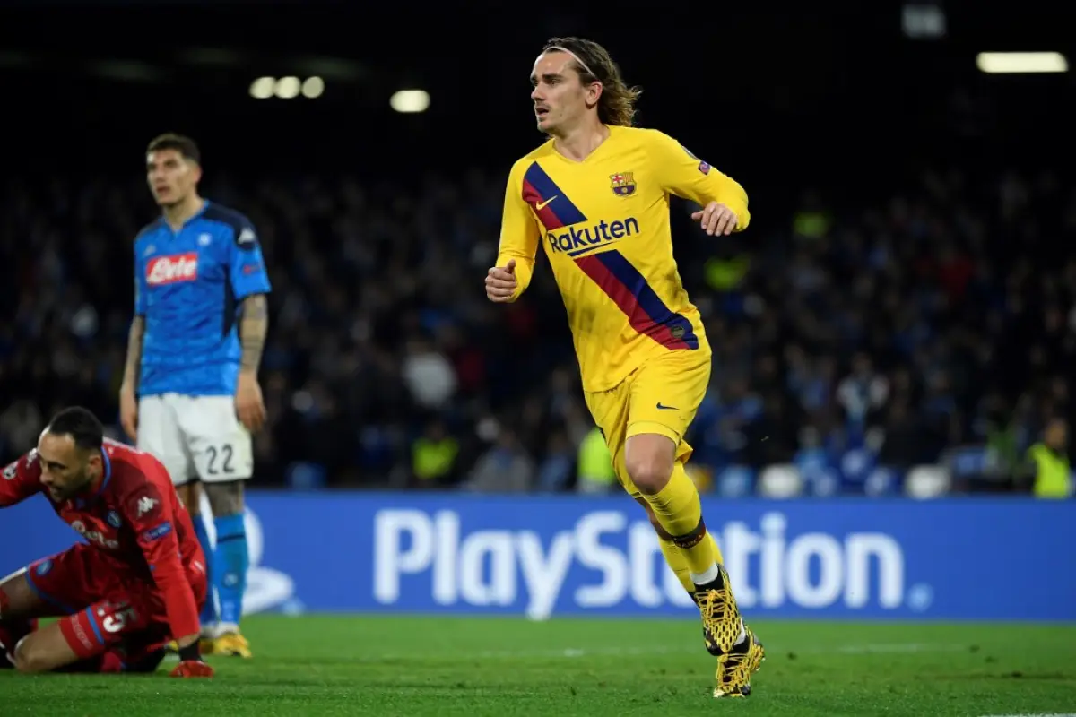 Barcelona's French forward Antoine Griezmann celebrates after scoring a goal during the UEFA Champions League round of 16 first-leg football match between SSC Napoli and FC Barcelona at the San Paolo Stadium in Naples on February 25, 2020. (Photo by Filip