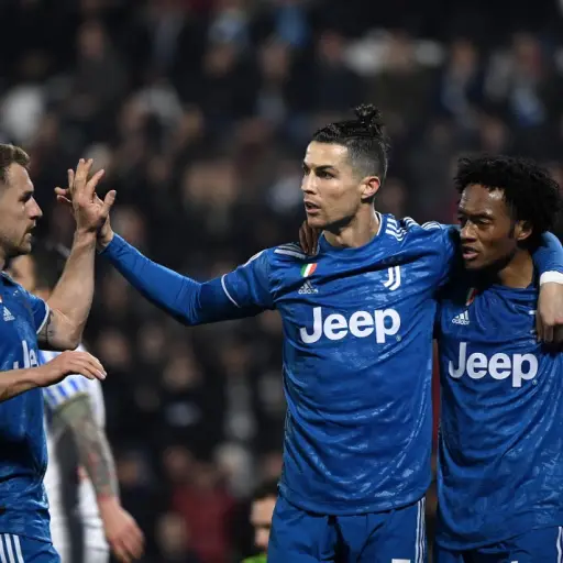 Cristiano celebra con Cuadrado su anotación. Foto: AFP