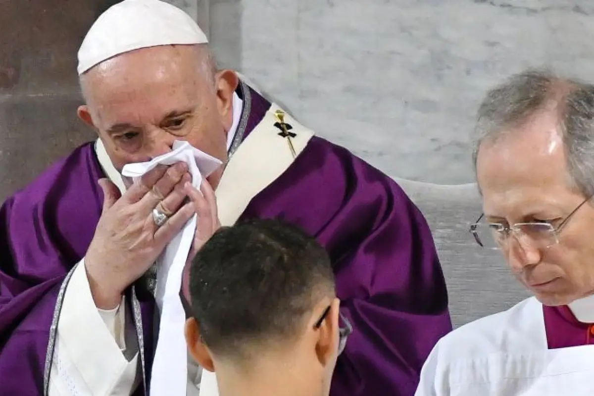 Pope Francis wipes his nose during the Ash Wednesday mass which opens Lent, the forty-day period of abstinence and deprivation for Christians before Holy Week and Easter, on February 26, 2020, at the Santa Sabina church in Rome. - Pope Francis postponed h