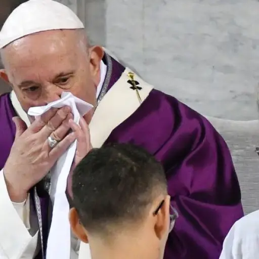 Pope Francis wipes his nose during the Ash Wednesday mass which opens Lent, the forty-day period of abstinence and deprivation for Christians before Holy Week and Easter, on February 26, 2020, at the Santa Sabina church in Rome. - Pope Francis postponed h