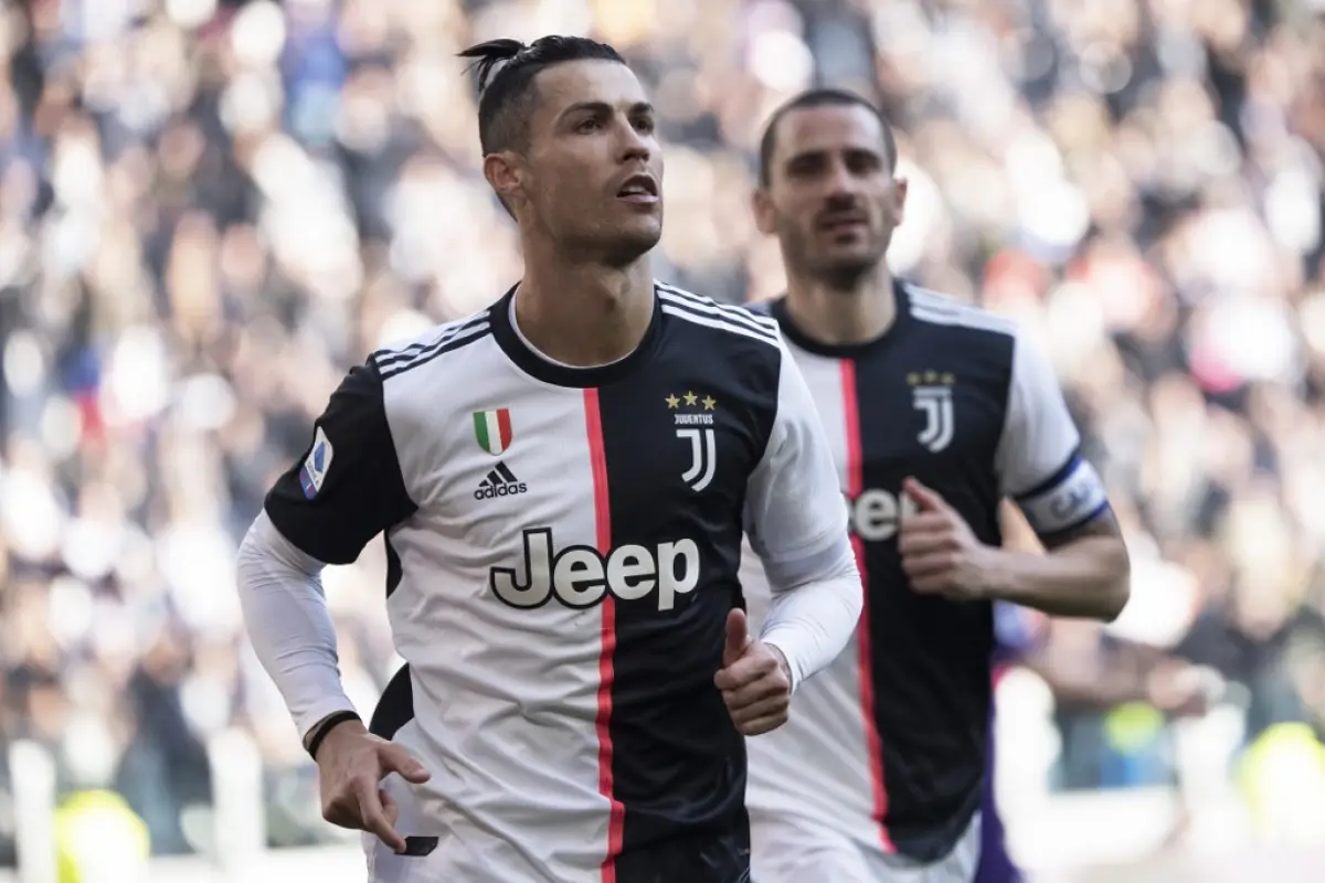 Juventus' Portuguese forward Cristiano Ronaldo celebrates after scoring his second penalty, and his 50th goal with Juventus, during the Italian Serie A football match Juventus vs Fiorentina on February 2, 2020 at the Juventus Allianz stadium in Turin. (Ph