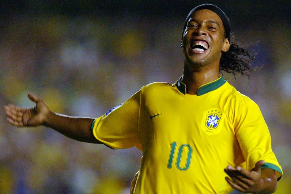 TO GO WITH AFP STORY BY MARCELO YUBERAS: Ronaldinho Gaucho search his redemption in a new era with the "Selecao".
(FILES) Brazilian player Ronaldinho celebrates after scoring the second goal of his team against Ecuador during their FIFA World Cup South Af