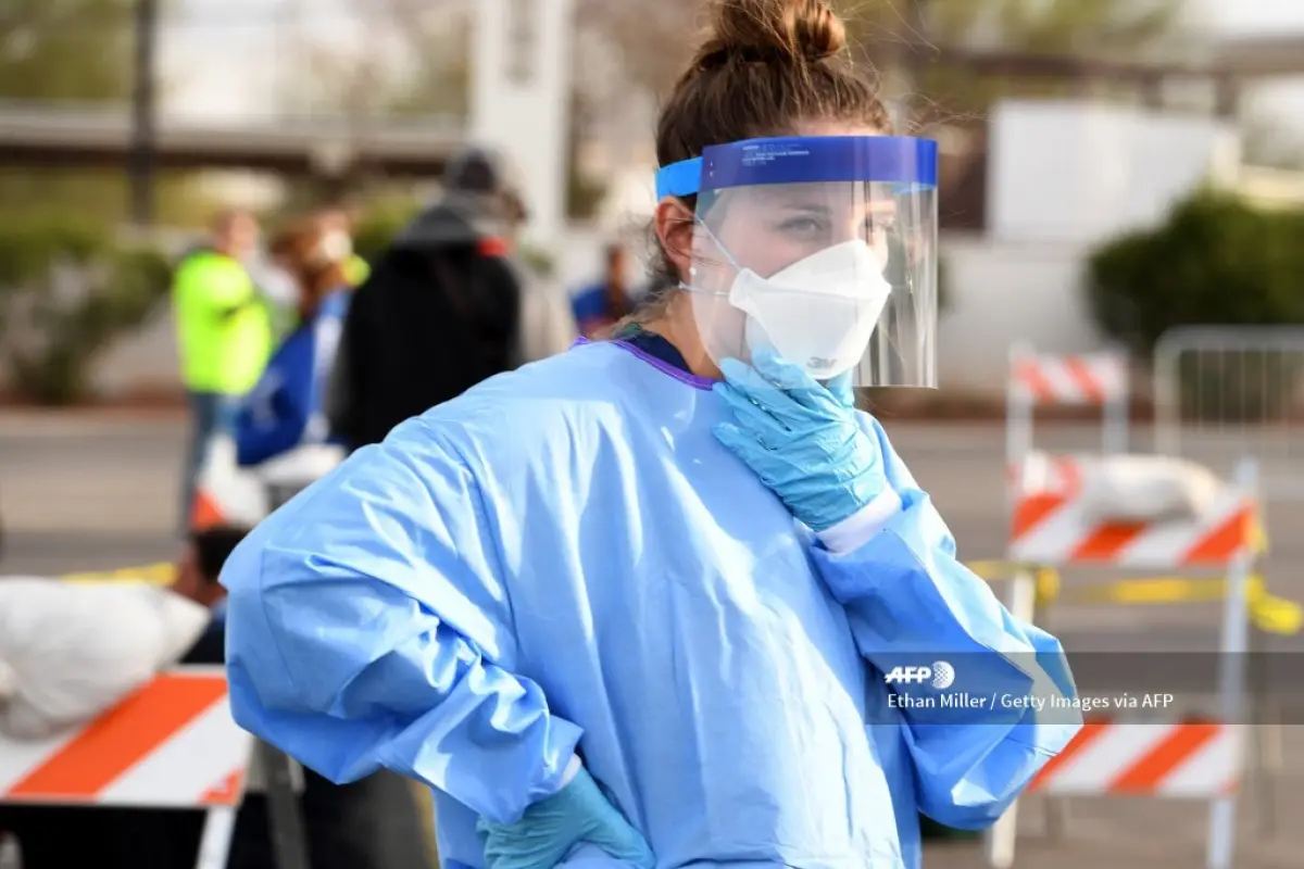 LAS VEGAS, NEVADA - MARCH 28: Touro University Nevada medical student Allison Boynton waits to conduct medical screenings at a temporary homeless shelter set up in a parking lot at Cashman Center on March 28, 2020 in Las Vegas, Nevada. Catholic Charities 