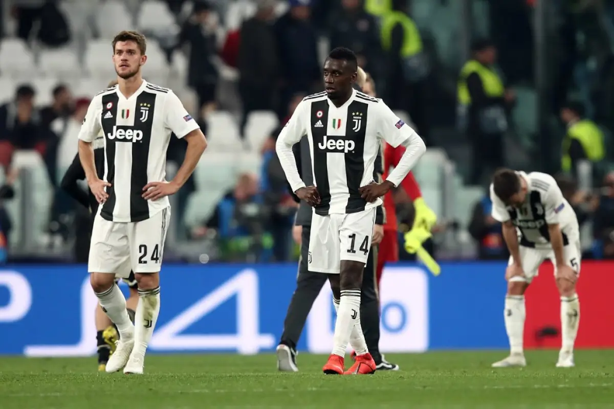 Juventus' Italian defender Daniele Rugani (L) and Juventus' French midfielder Blaise Matuidi react at the end of the UEFA Champions League quarter-final second leg football match Juventus vs Ajax Amsterdam on April 16, 2019 at the Juventus stadium in Turi