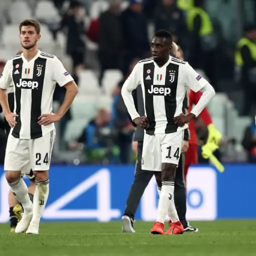 Juventus' Italian defender Daniele Rugani (L) and Juventus' French midfielder Blaise Matuidi react at the end of the UEFA Champions League quarter-final second leg football match Juventus vs Ajax Amsterdam on April 16, 2019 at the Juventus stadium in Turi