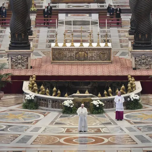 This photo taken and handout on April 12, 2020 by the Vatican Media shows Pope Francis (Bottom C) deliver his Urbi et Orbi message following Easter Sunday Mass on April 12, 2020 behind closed doors at St. Peter's Basilica in The Vatican, during the countr